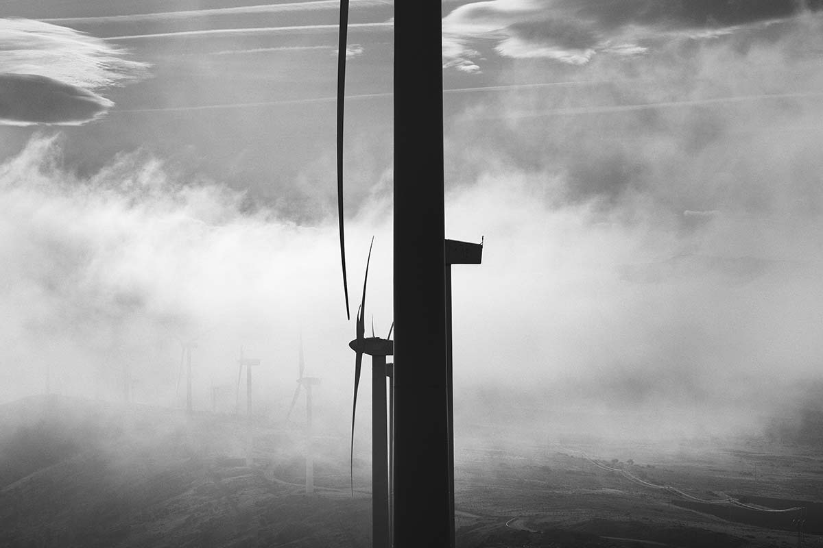 Wind turbines amid fog in Aldeavieja
