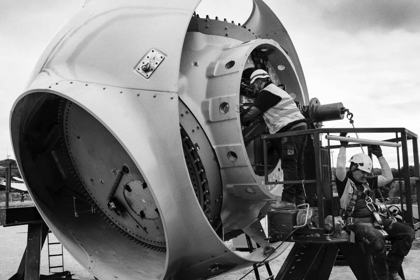 Workers inside the rotor of a wind turbine at the Muniesa Wind Farm