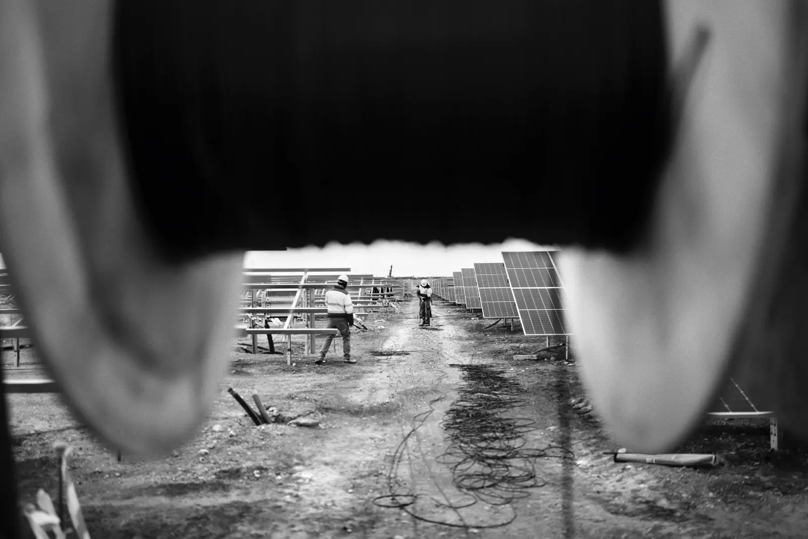 Workers installing photovoltaic panels at the future solar plant in Andorra